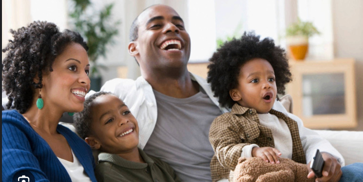Black family enjoying time together at home
